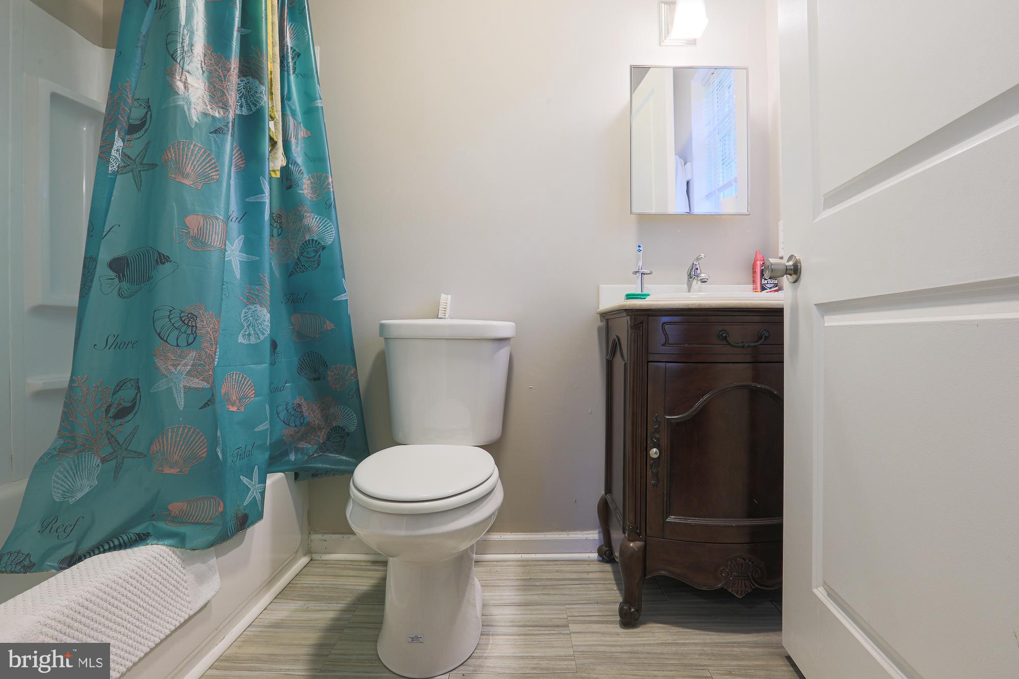 4604 East Joppa Road Perry Hall, MD 21128 - Photo 44 of 56 a bathroom with a sink and a mirror