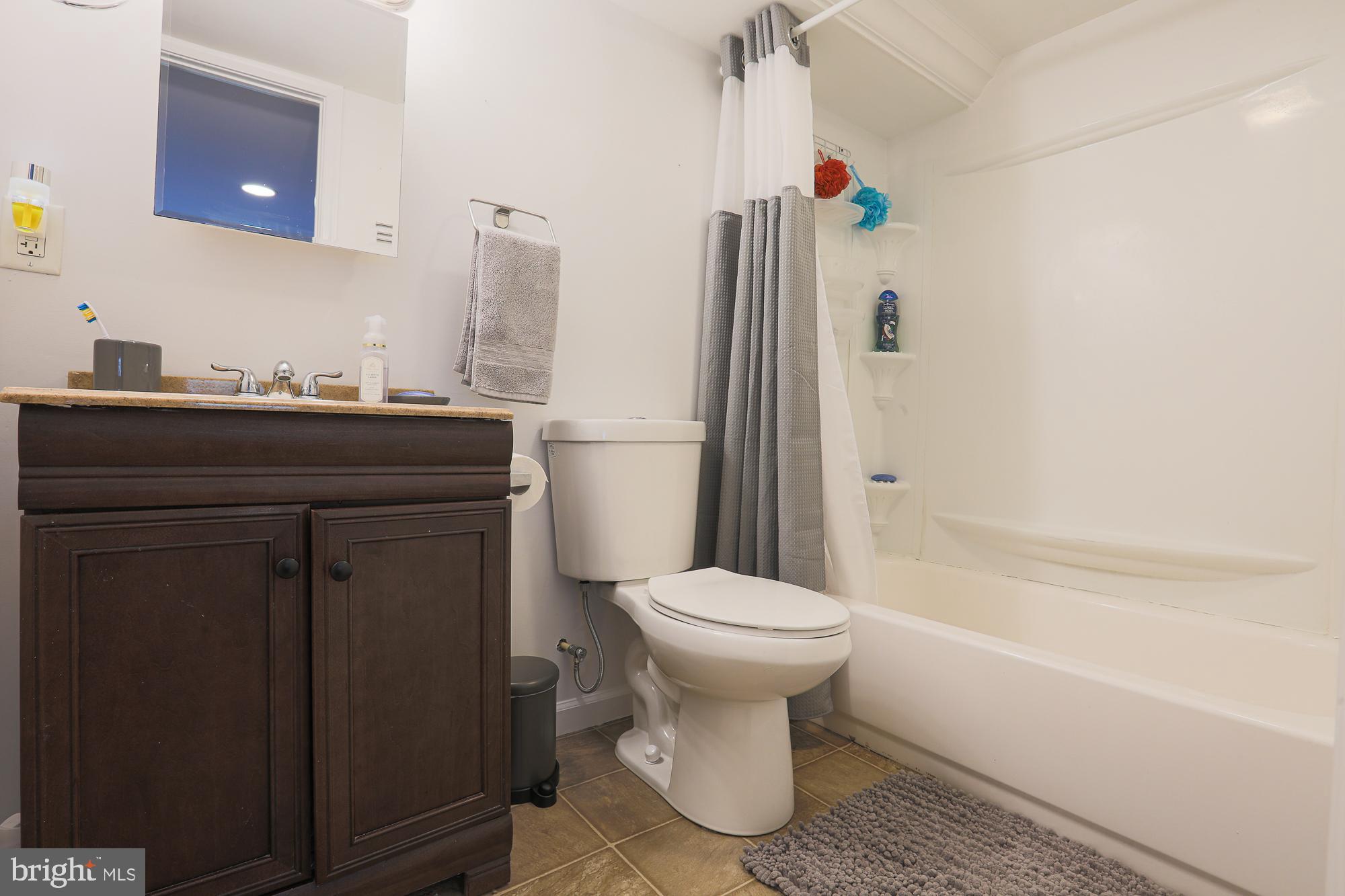 4604 East Joppa Road Perry Hall, MD 21128 - Photo 45 of 56 a bathroom with a sink toilet and shower
