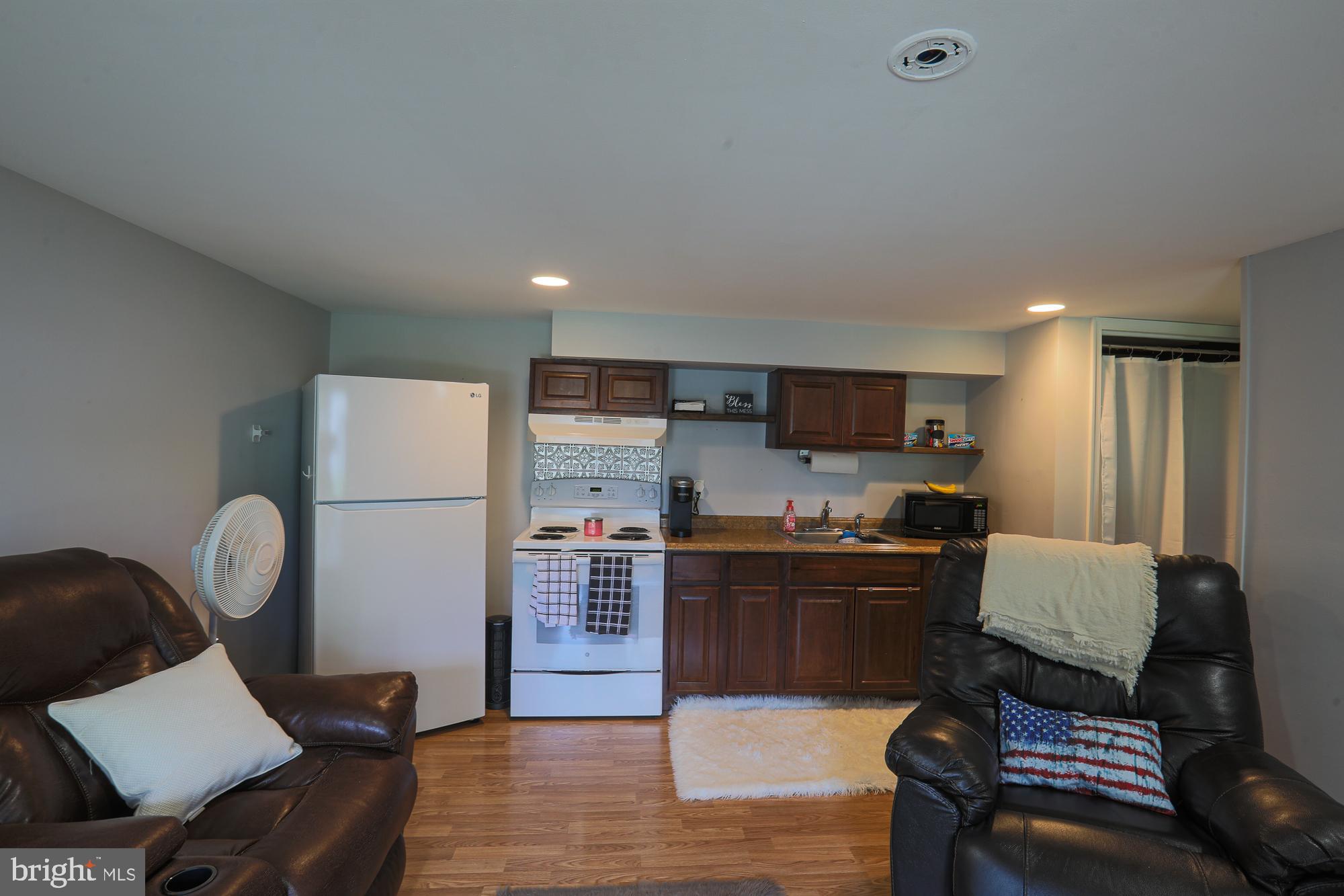 4604 East Joppa Road Perry Hall, MD 21128 - Photo 50 of 56 a living room with furniture and a flat screen tv
