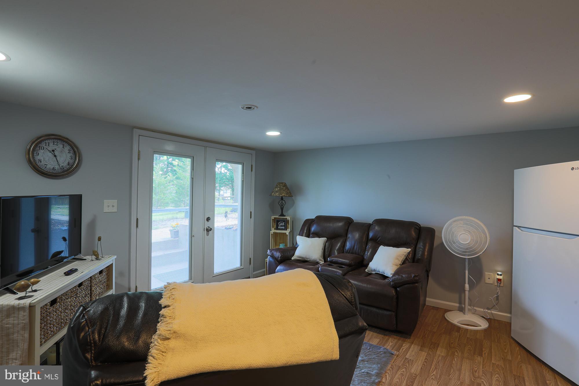 4604 East Joppa Road Perry Hall, MD 21128 - Photo 52 of 56 a bed room with furniture and a flat screen tv