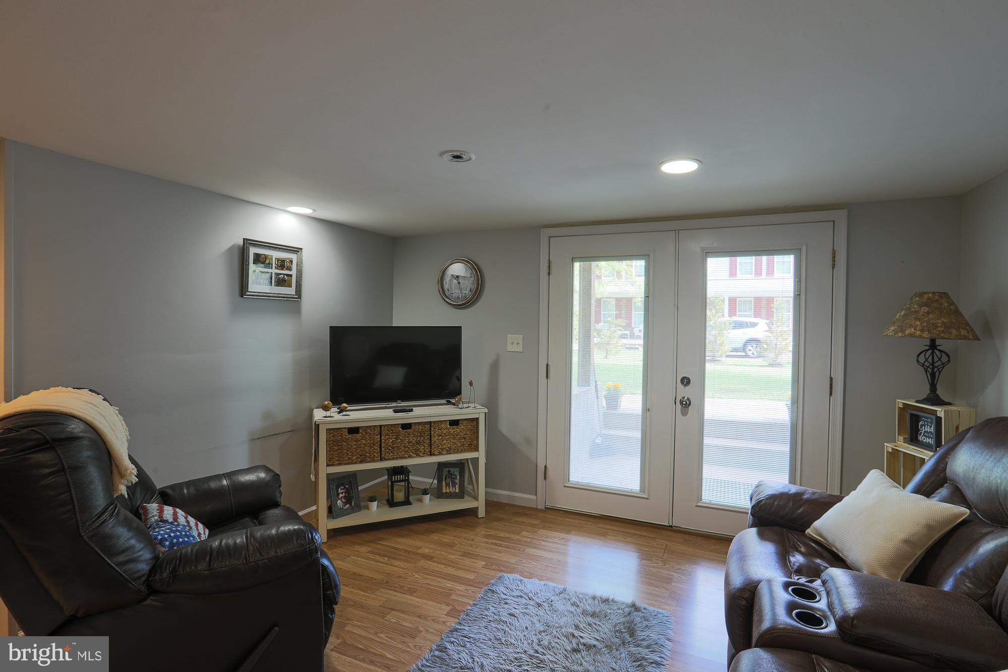 4604 East Joppa Road Perry Hall, MD 21128 - Photo 54 of 56 a living room with furniture and a flat screen tv