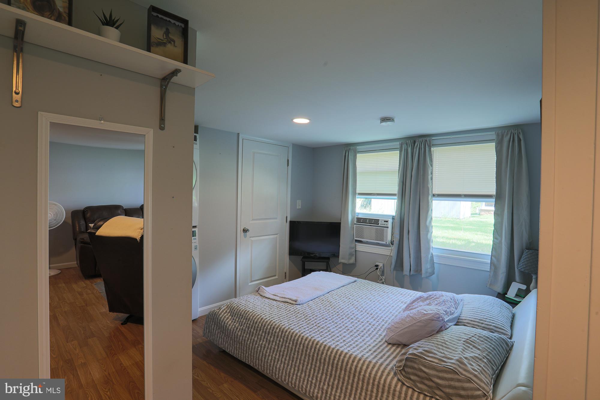 4604 East Joppa Road Perry Hall, MD 21128 - Photo 56 of 56 a bedroom with a bed and a mirror