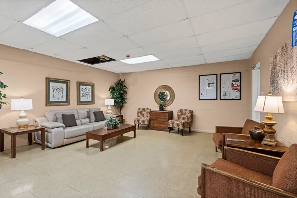 a living room with furniture and a large window