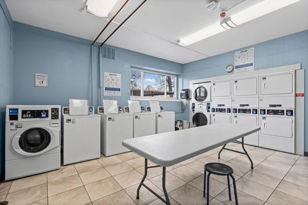 a kitchen with refrigerator and cabinets