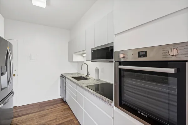 a kitchen with a sink and a microwave