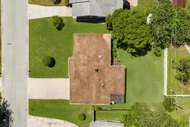 a aerial view of a house with a yard