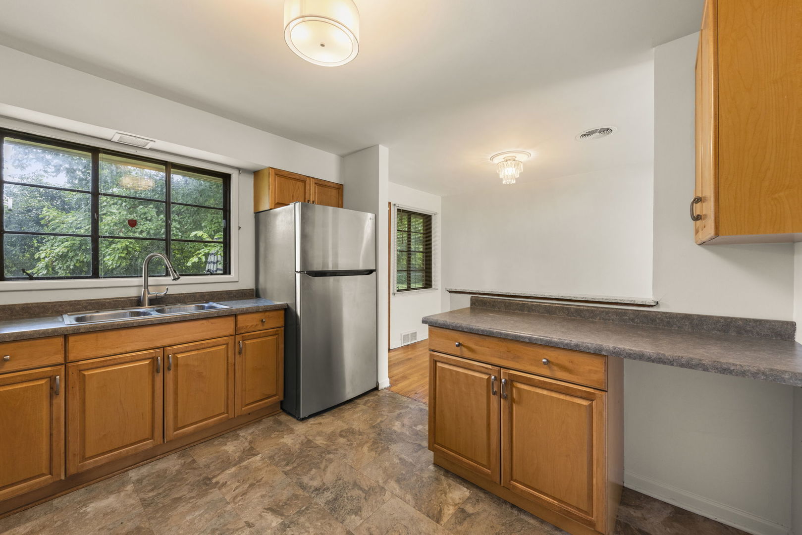 18508 Clyde Road Homewood, IL 60430 - Photo 9 of 20 a kitchen with stainless steel appliances granite countertop a refrigerator and a sink