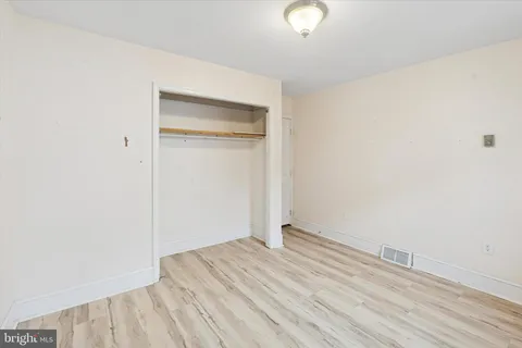 a view of room with wooden floor