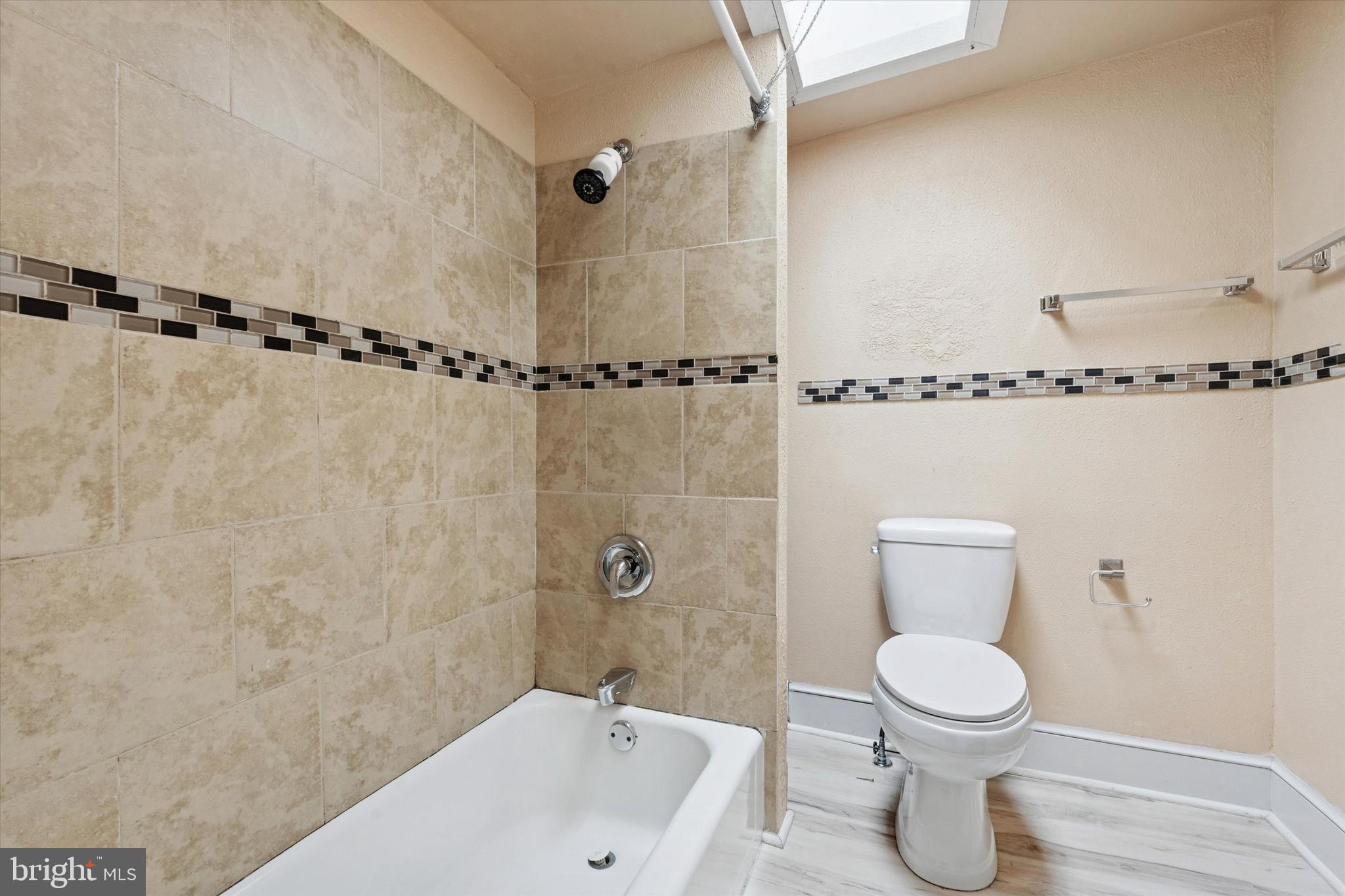 933 Cantrell Street Philadelphia, PA 19148 - Photo 20 of 25 a bathroom with a toilet a sink and shower