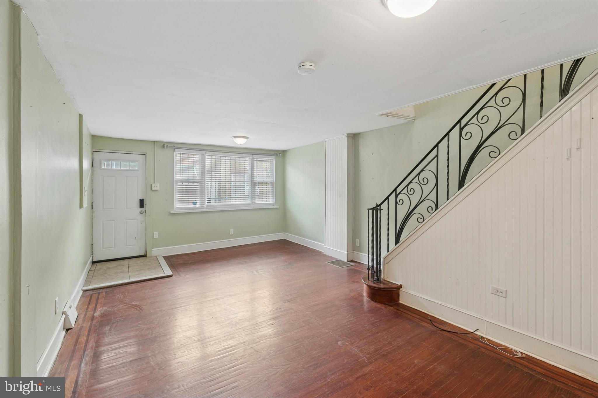 933 Cantrell Street Philadelphia, PA 19148 - Photo 2 of 25 a view of an empty room with wooden floor and stairs