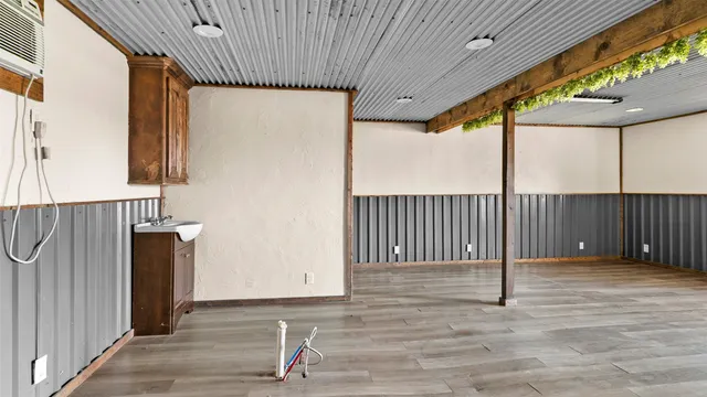 a view of a porch with wooden floor