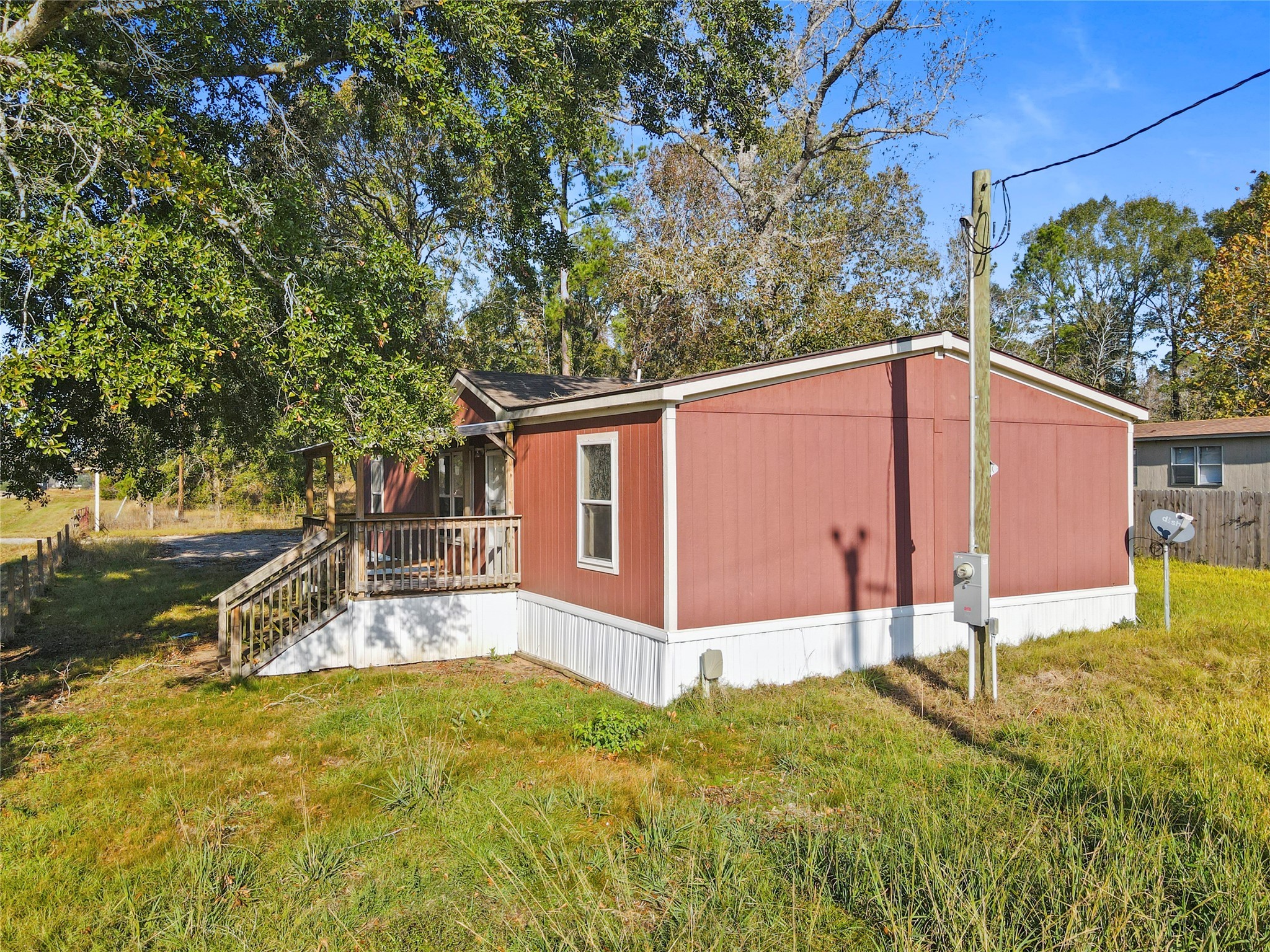 10499 Highway 156 Coldspring, TX 77331 - Photo 39 of 45 a backyard of a house with table and chairs