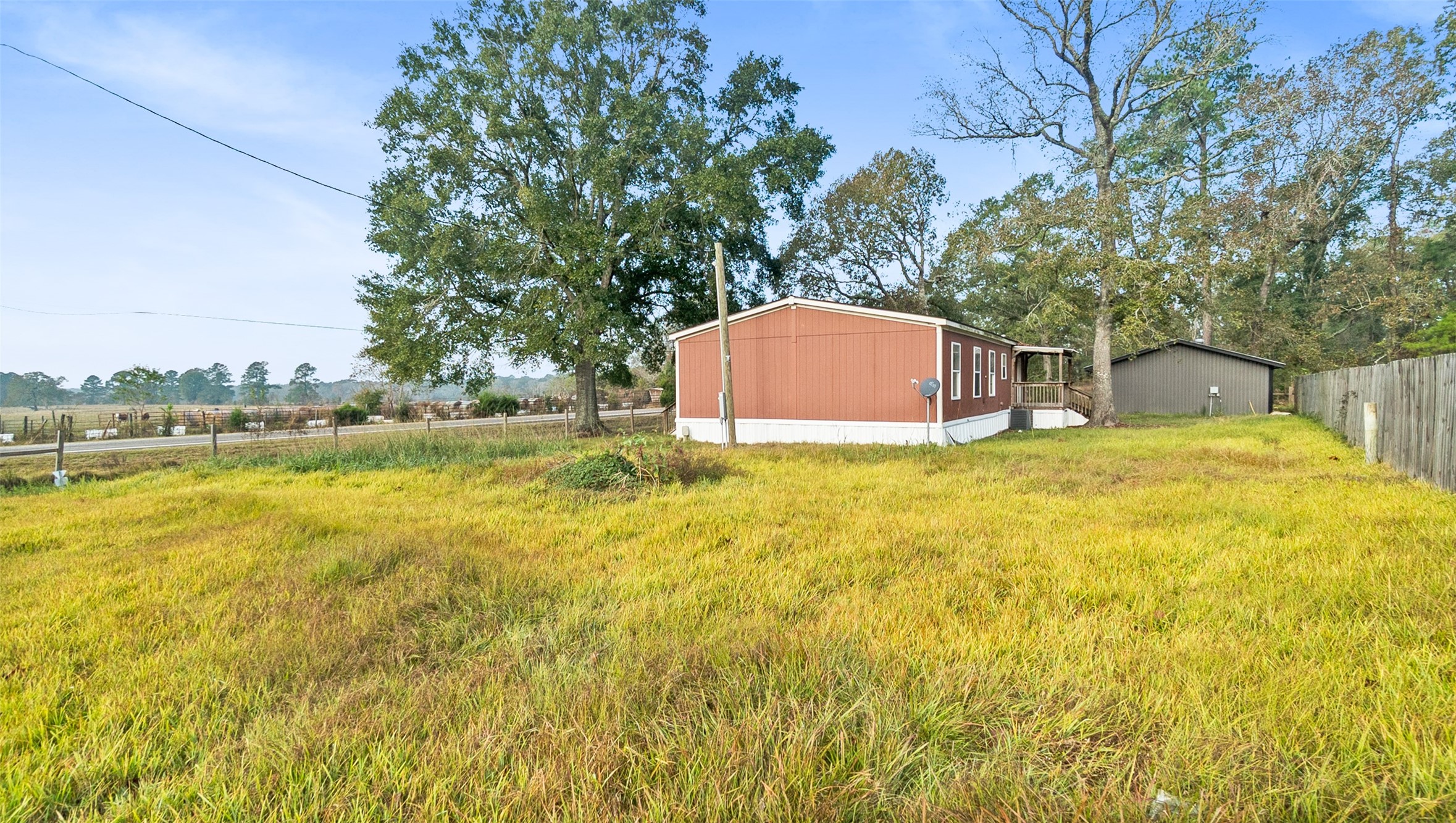 10499 Highway 156 Coldspring, TX 77331 - Photo 5 of 45 a view of a swimming pool with an outdoor space and seating area