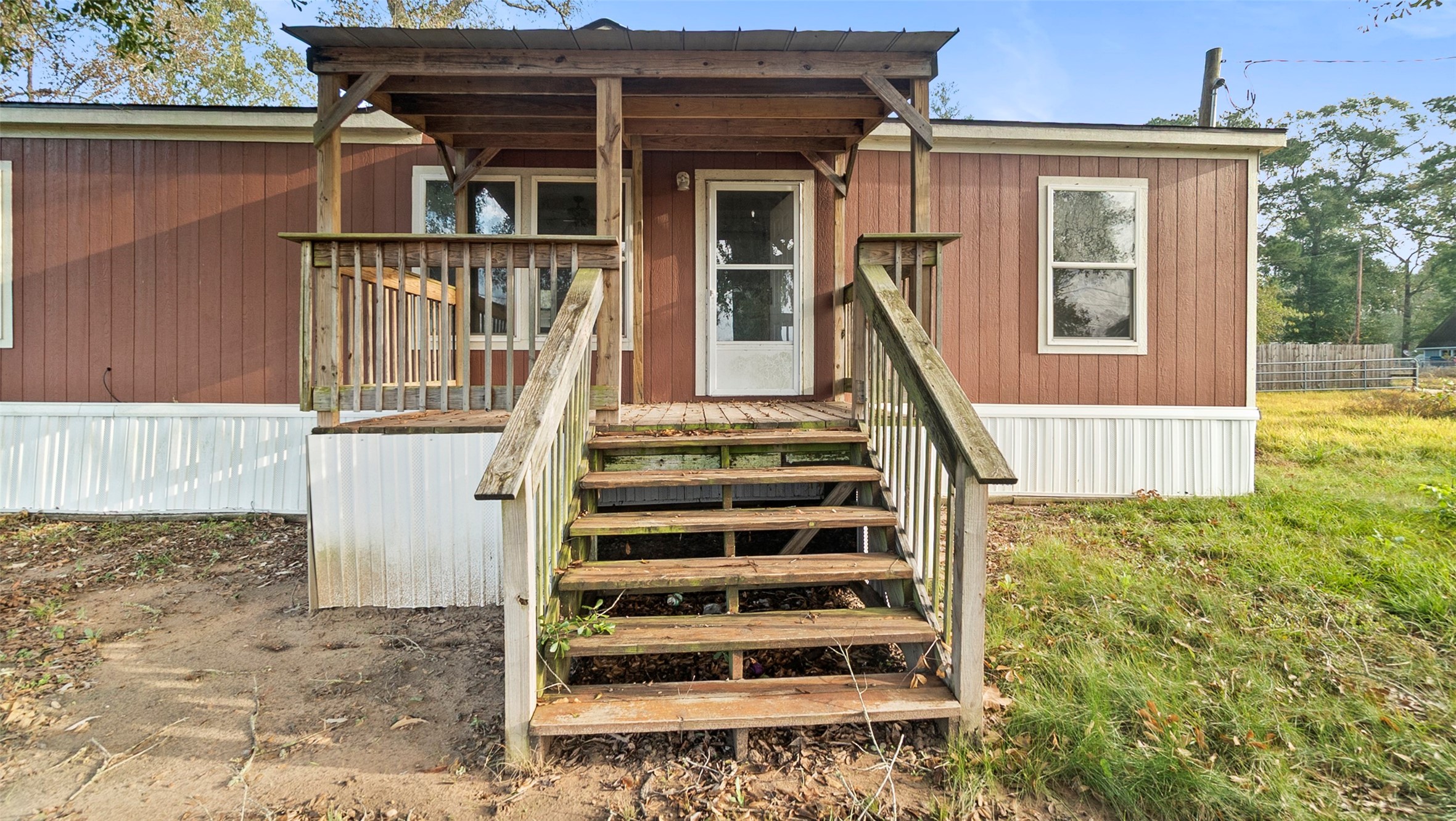 10499 Highway 156 Coldspring, TX 77331 - Photo 6 of 45 front view of a house with a small yard