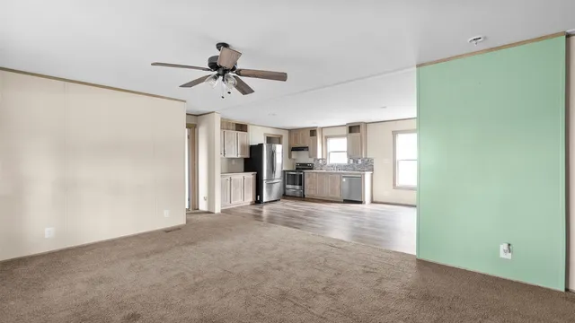 a view of a kitchen with a sink and cabinet area