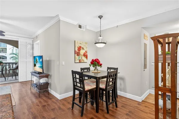 a view of a dining room with furniture window and outside view