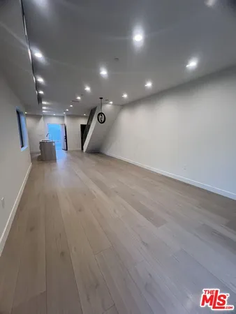 a view of a hall with an entryway