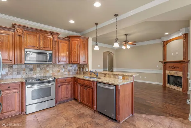 a kitchen with a sink stove and microwave
