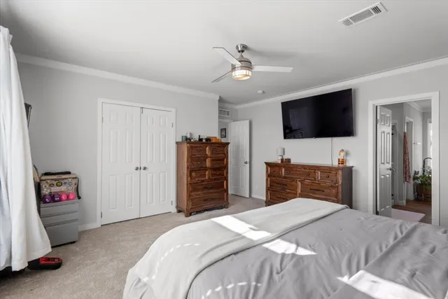 a bedroom with furniture and a window