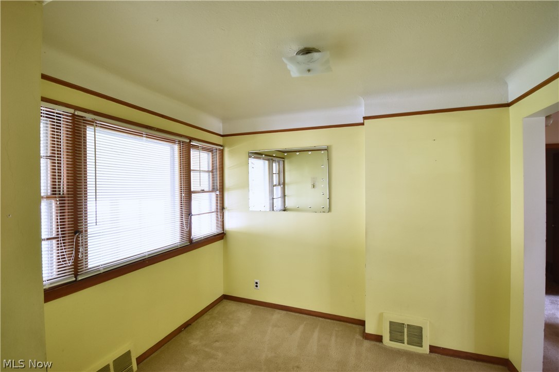 31921 Pendley Road Willowick, OH 44095 - Photo 9 of 22 big window overlooking porch, carpet flooring, right off kitchen