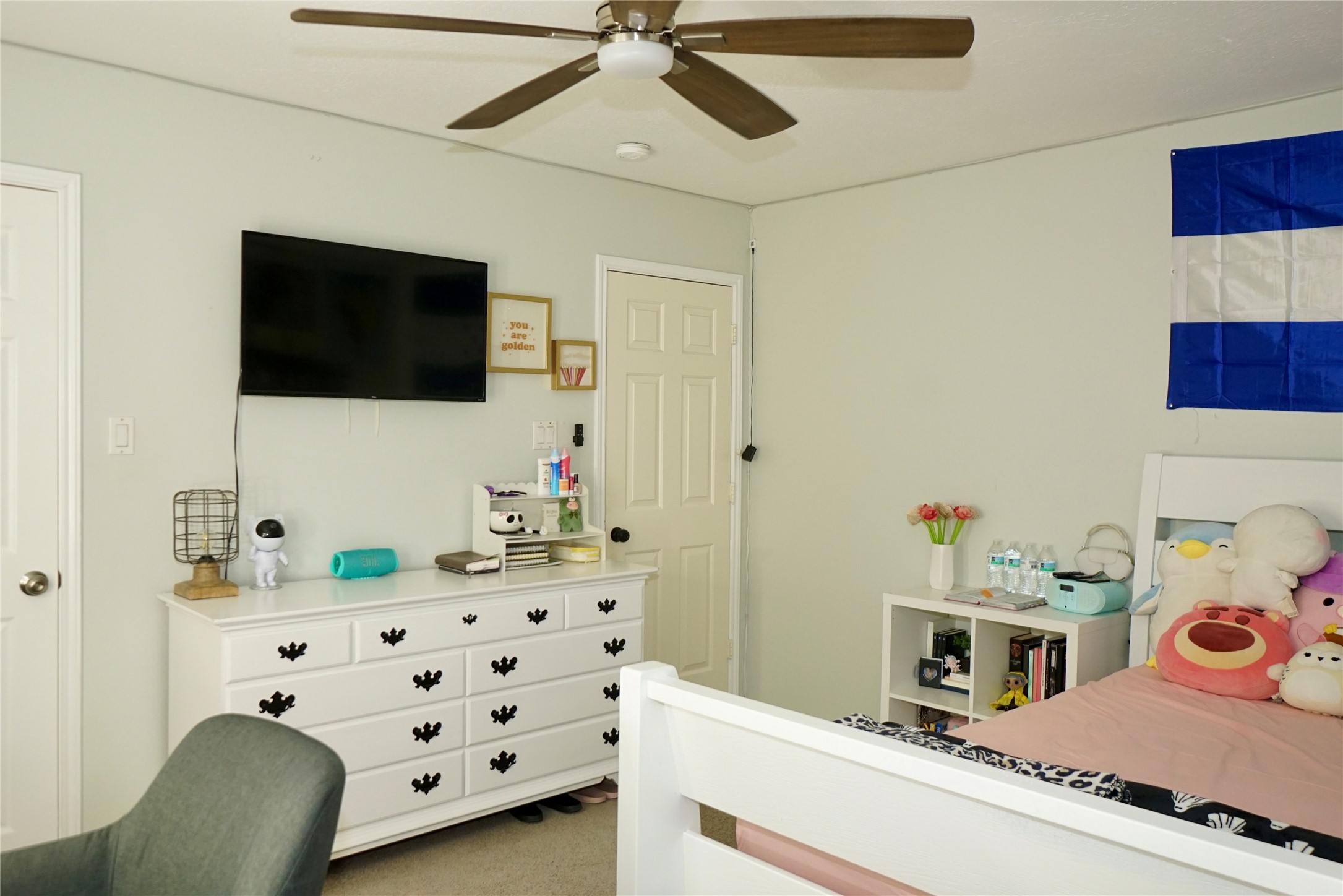1806 Shadow Haven Court Fresno, TX 77545 - Photo 14 of 22 a bedroom with a bed and a flat tv screen on the dresser in it