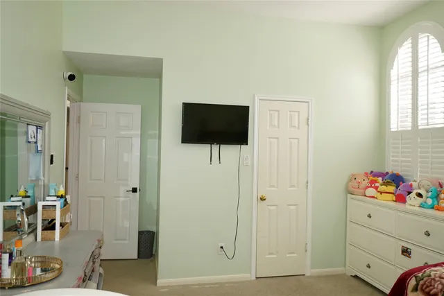 a view of room with wooden floor cabinet and window