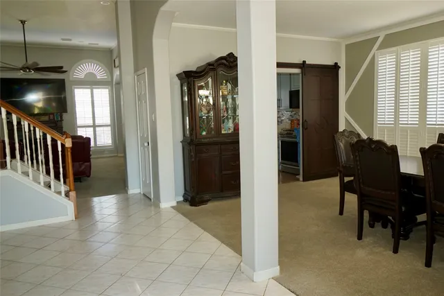 a view of a hallway with furniture and a livingroom view