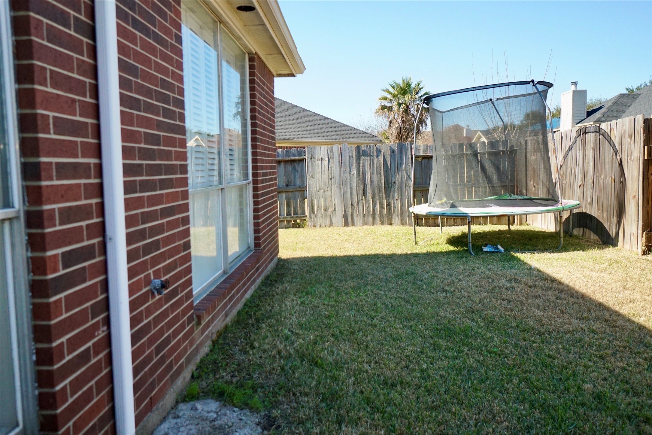 1806 Shadow Haven Court Fresno, TX 77545 - Photo 20 of 22 a view of a house with backyard and sitting area