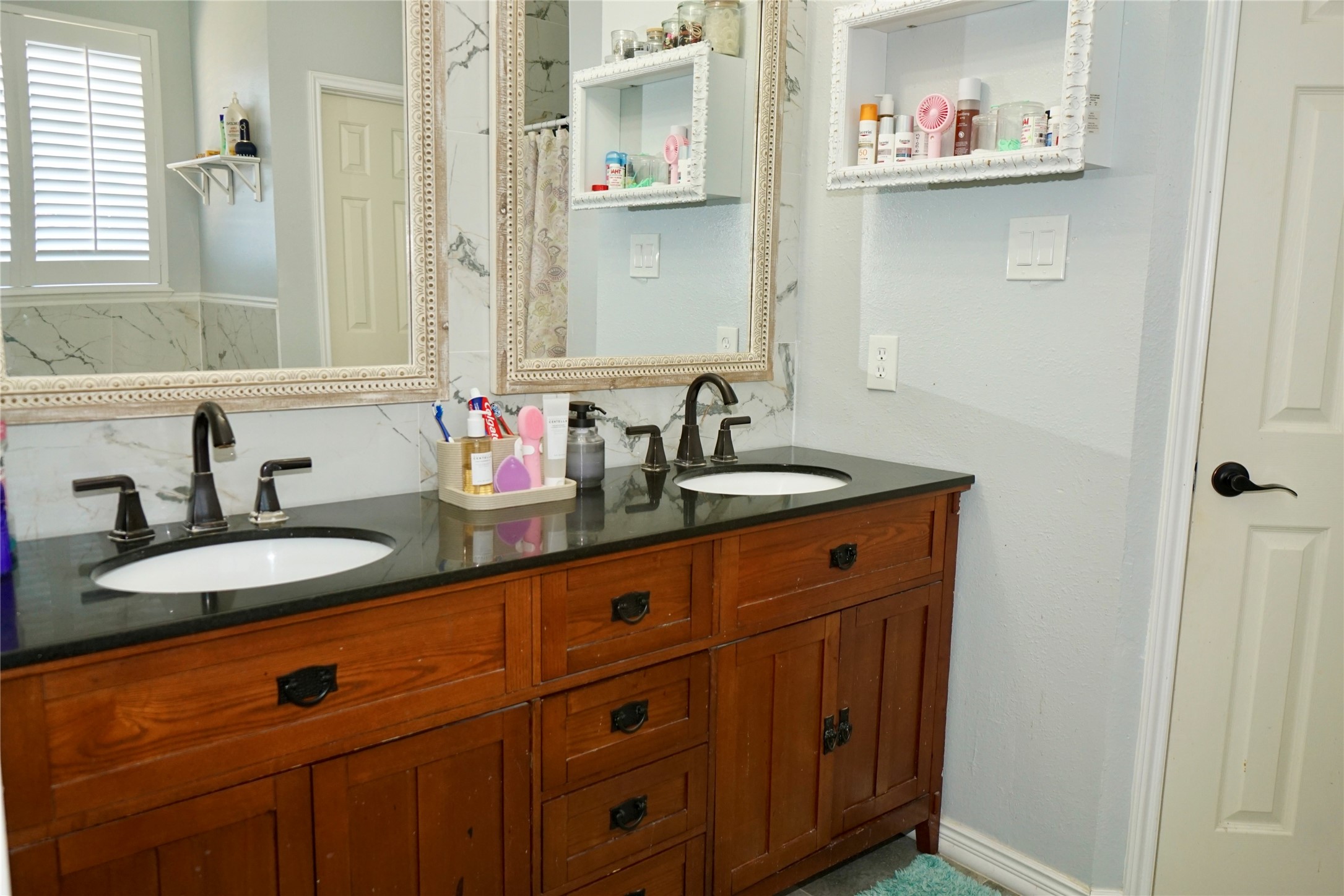 1806 Shadow Haven Court Fresno, TX 77545 - Photo 9 of 22 a bathroom with a sink and a mirror