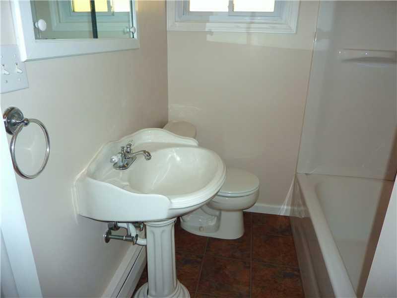 952 Harper Road Crescent, PA 15046 - Photo 8 of 18 Full Bath. FIRST FLOOR FULL BATH WITH PEDESTAL SINK, NEW TUB AND SURROUNG AND NEW FLOORING.