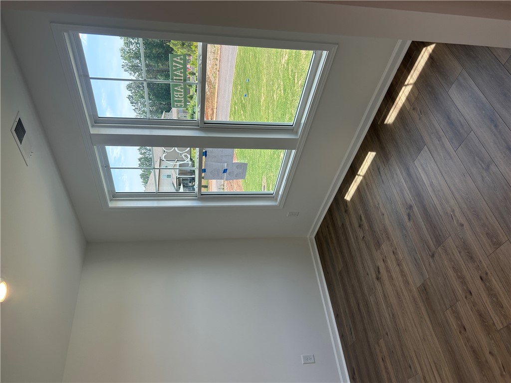 202 Bellflower Lane Pendleton, SC 29670 - Photo 5 of 27 Well-lit interior featuring contemporary flooring and ample natural light from generously sized windows.