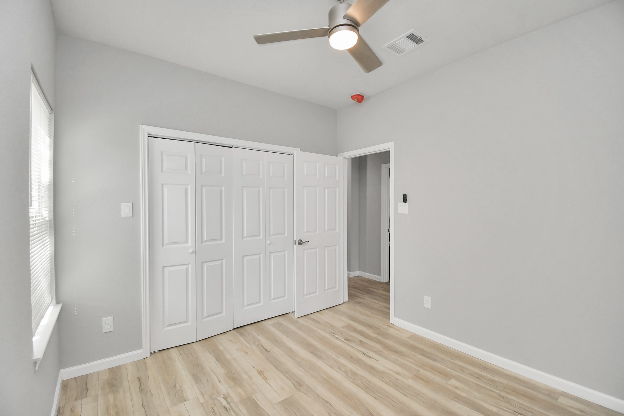 5941 Southlea Street Houston, TX 77033 - Photo 17 of 31 wooden floor in an empty room