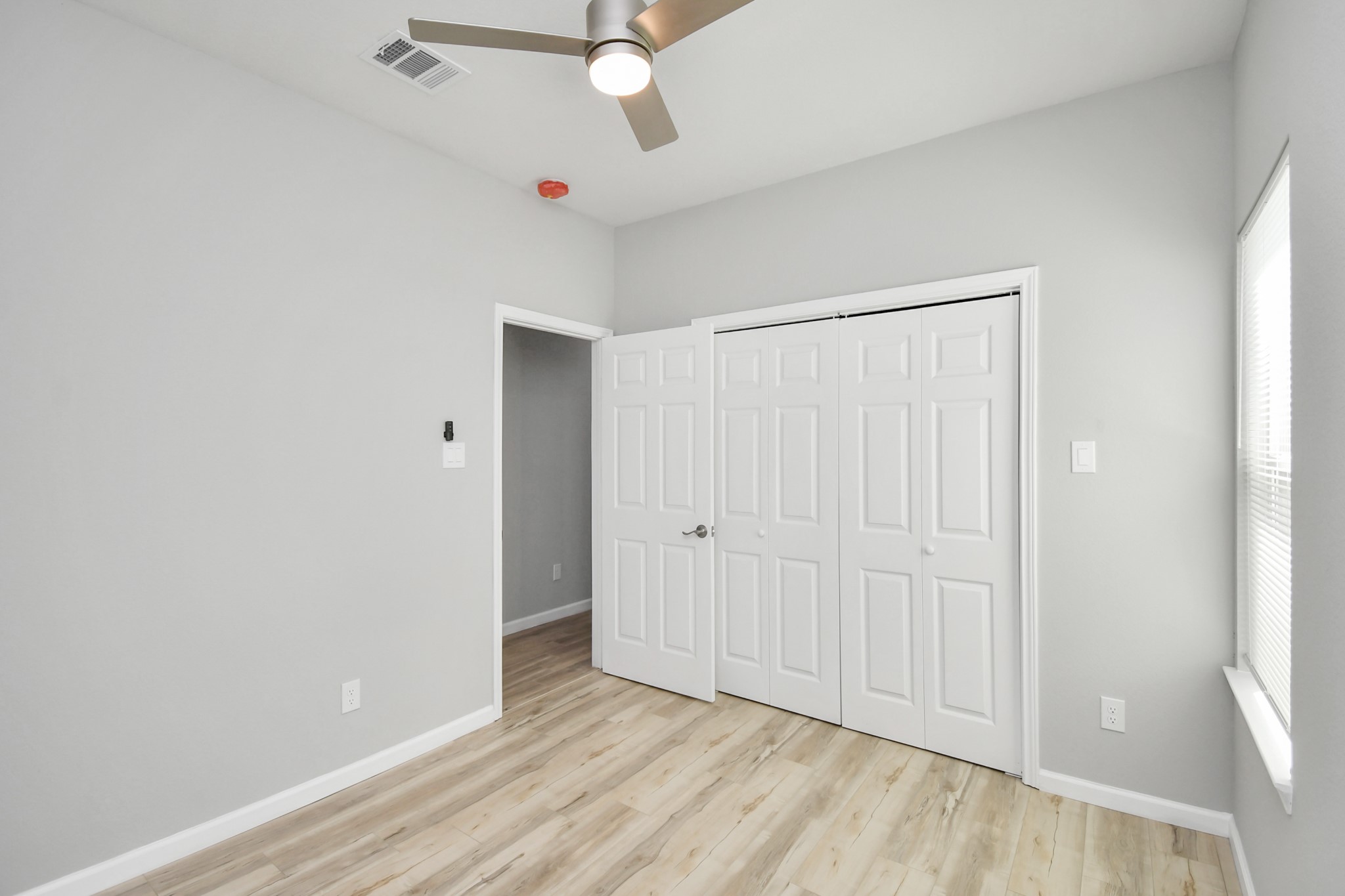 5941 Southlea Street Houston, TX 77033 - Photo 27 of 31 a view of an empty room with wooden floor