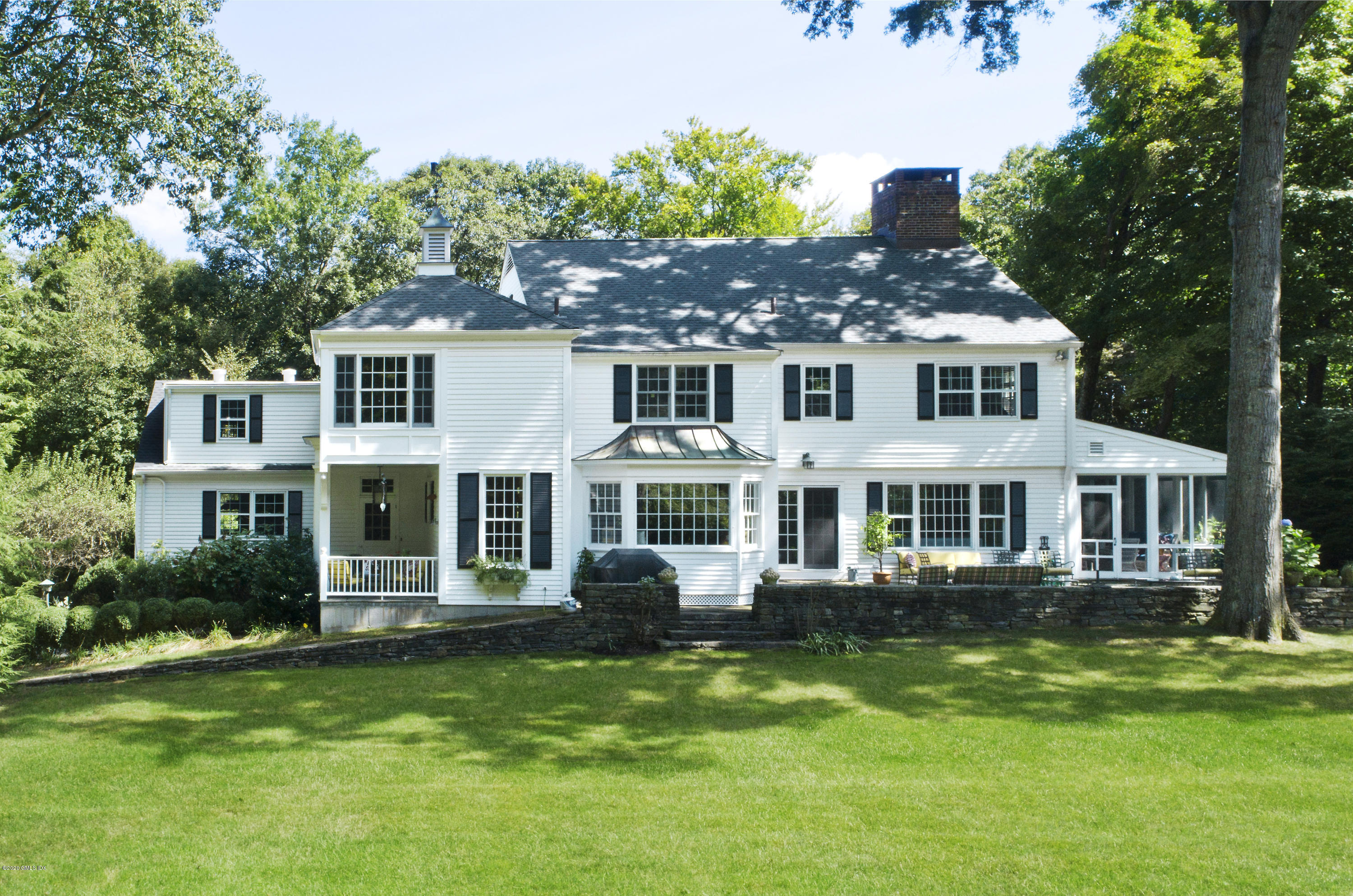 85 Perkins Road Greenwich, CT 06830 - Photo 24 of 36 front view of a house with a yard