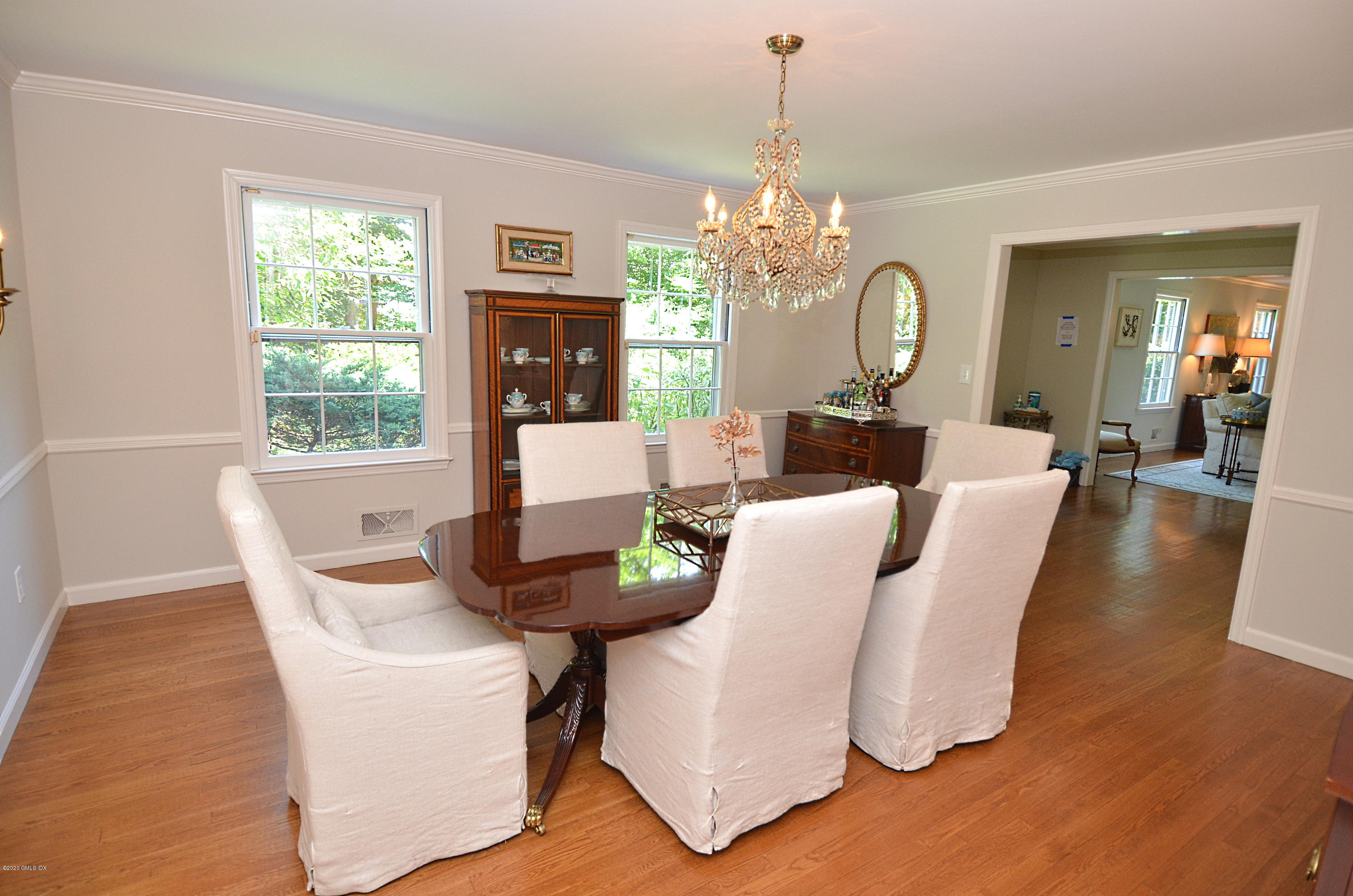 85 Perkins Road Greenwich, CT 06830 - Photo 8 of 36 a living room with fireplace furniture and a chandelier