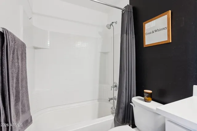 a bathroom with a bathtub and toilet