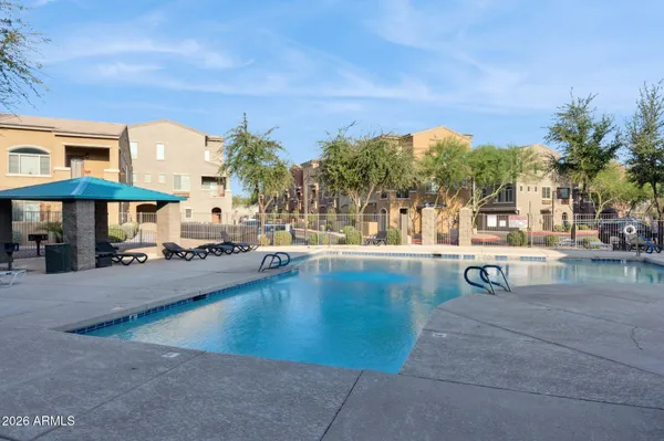 a view of a swimming pool with a patio