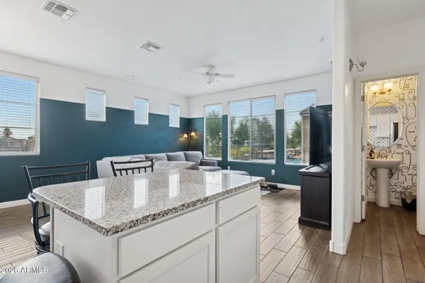 a kitchen with center island and stainless steel appliances