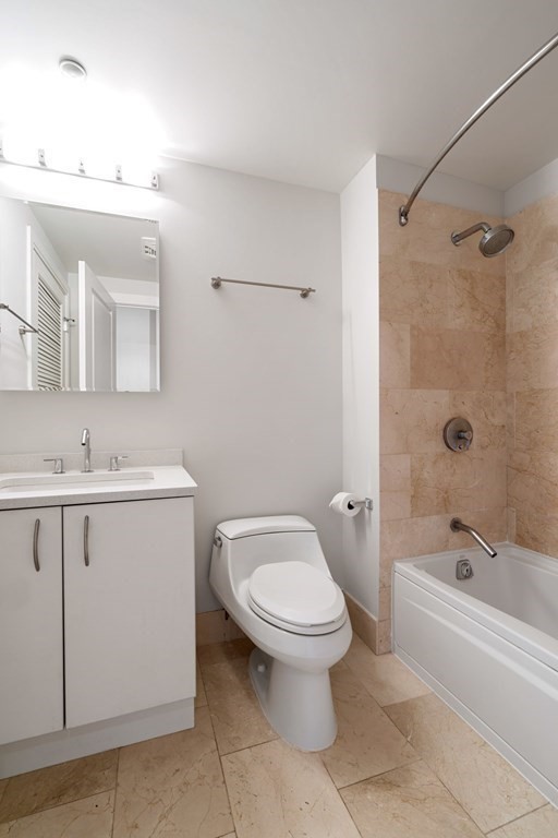 1910 Dorchester Avenue, Unit 601 Boston, MA 02124 - Photo 11 of 15 a bathroom with a sink toilet and shower