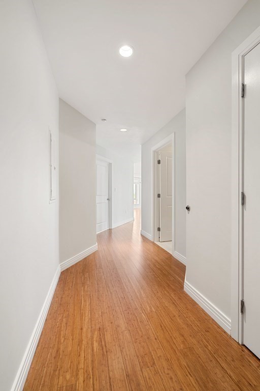 1910 Dorchester Avenue, Unit 601 Boston, MA 02124 - Photo 12 of 15 a view of an empty room with wooden floor