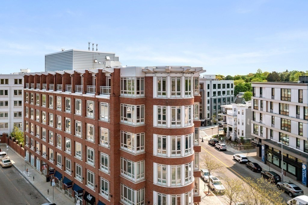 1910 Dorchester Avenue, Unit 601 Boston, MA 02124 - Photo 13 of 15 a view of a building with many windows