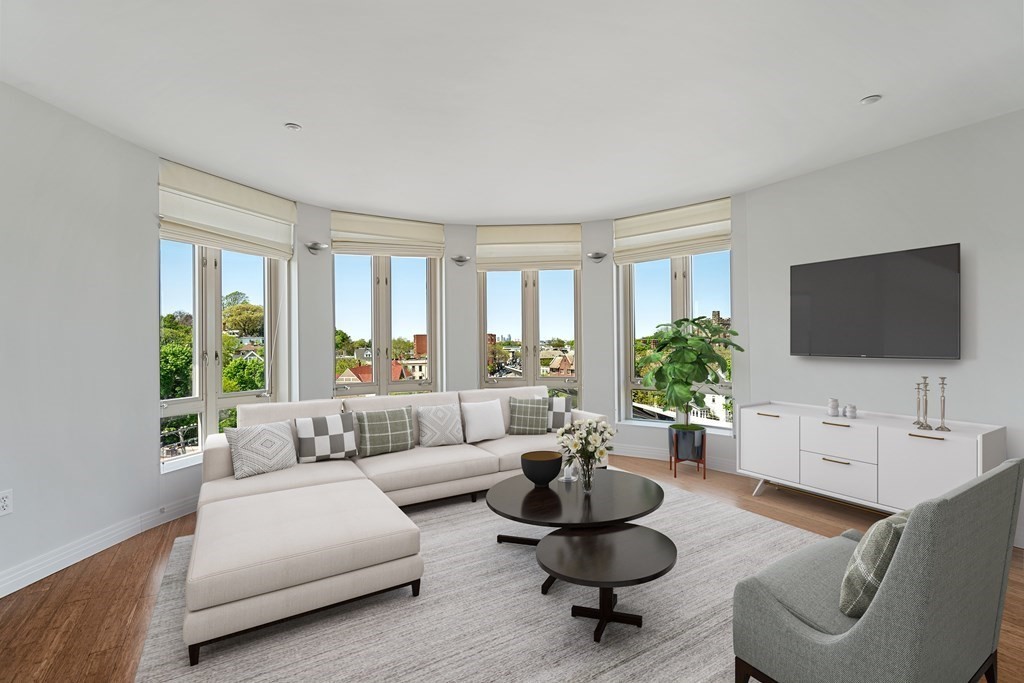 1910 Dorchester Avenue, Unit 601 Boston, MA 02124 - Photo 2 of 15 a living room with furniture and a flat screen tv
