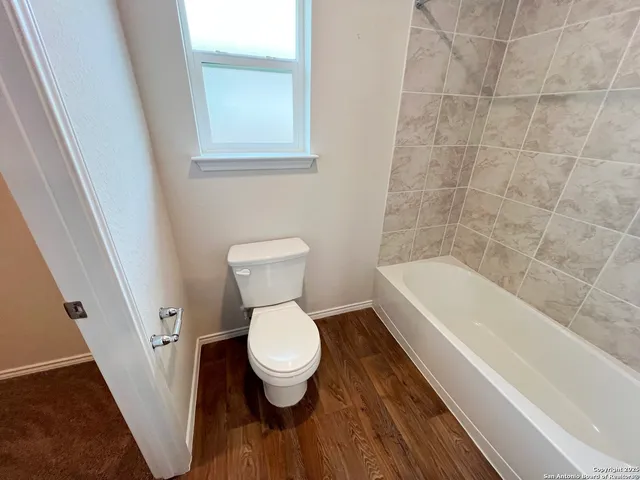 a bathroom with a bathtub and a sink