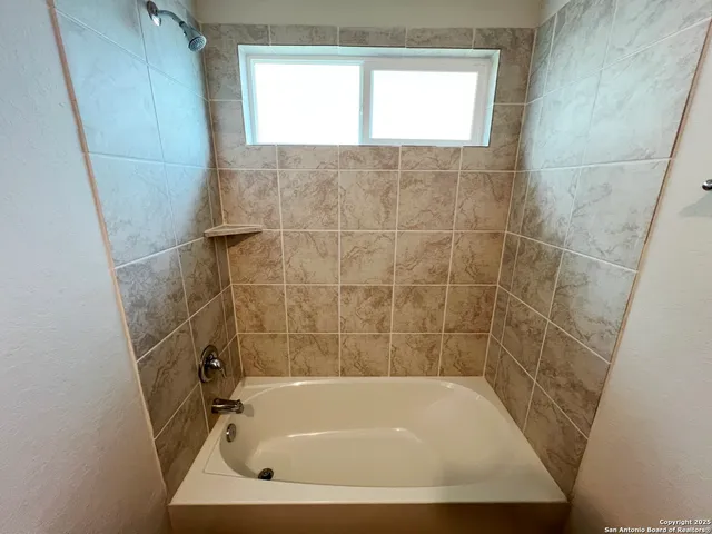 a bathroom with a bathtub