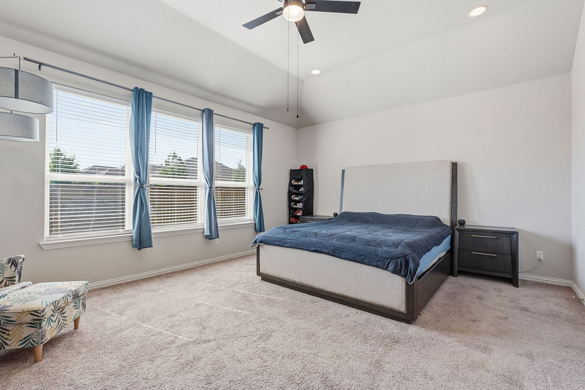 12616 Twisted Root Drive Manchaca, TX 78652 - Photo 4 of 36 Featuring four spacious bedrooms including this secluded primary suite complete with its own ensuite bath.
