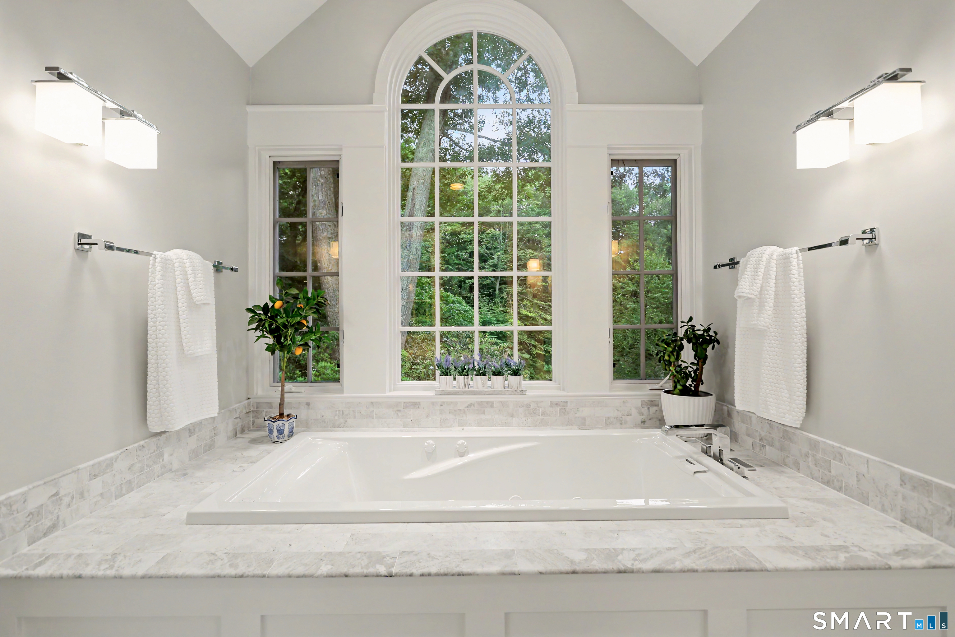 108 Logan Road New Canaan, CT 06840 - Photo 22 of 40 a view of a bathroom with a bathtub