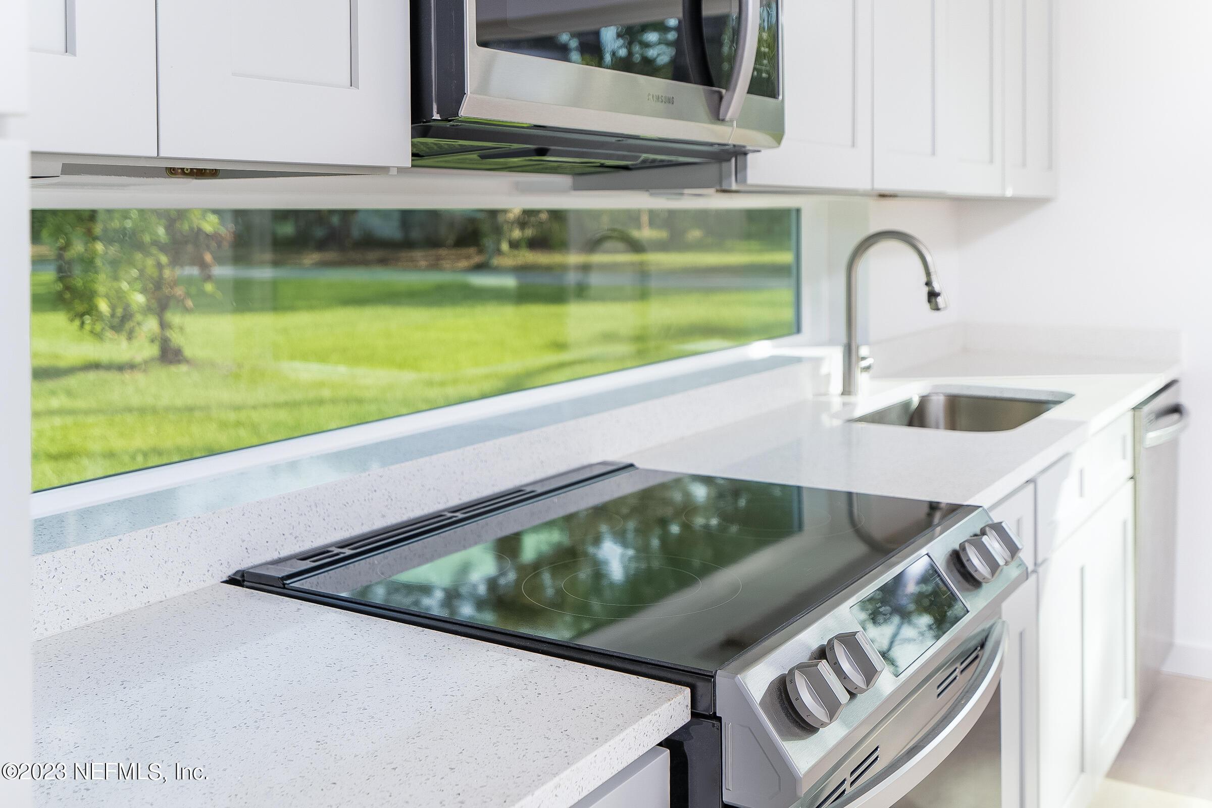 210 Yarbrough Road St. Augustine, FL 32095 - Photo 13 of 34 a kitchen with a sink and bathtub