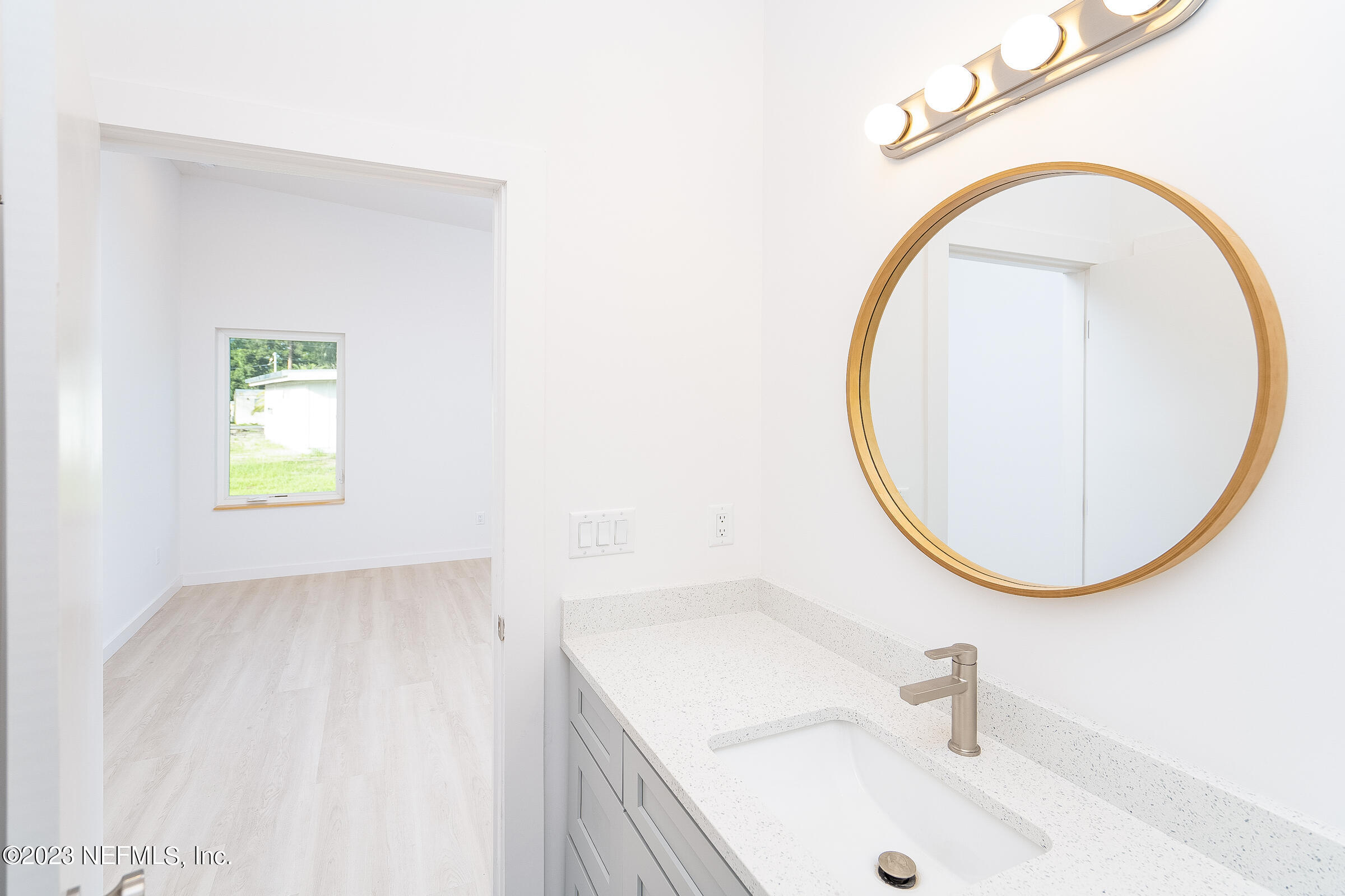 210 Yarbrough Road St. Augustine, FL 32095 - Photo 21 of 34 a bathroom with a sink and a mirror