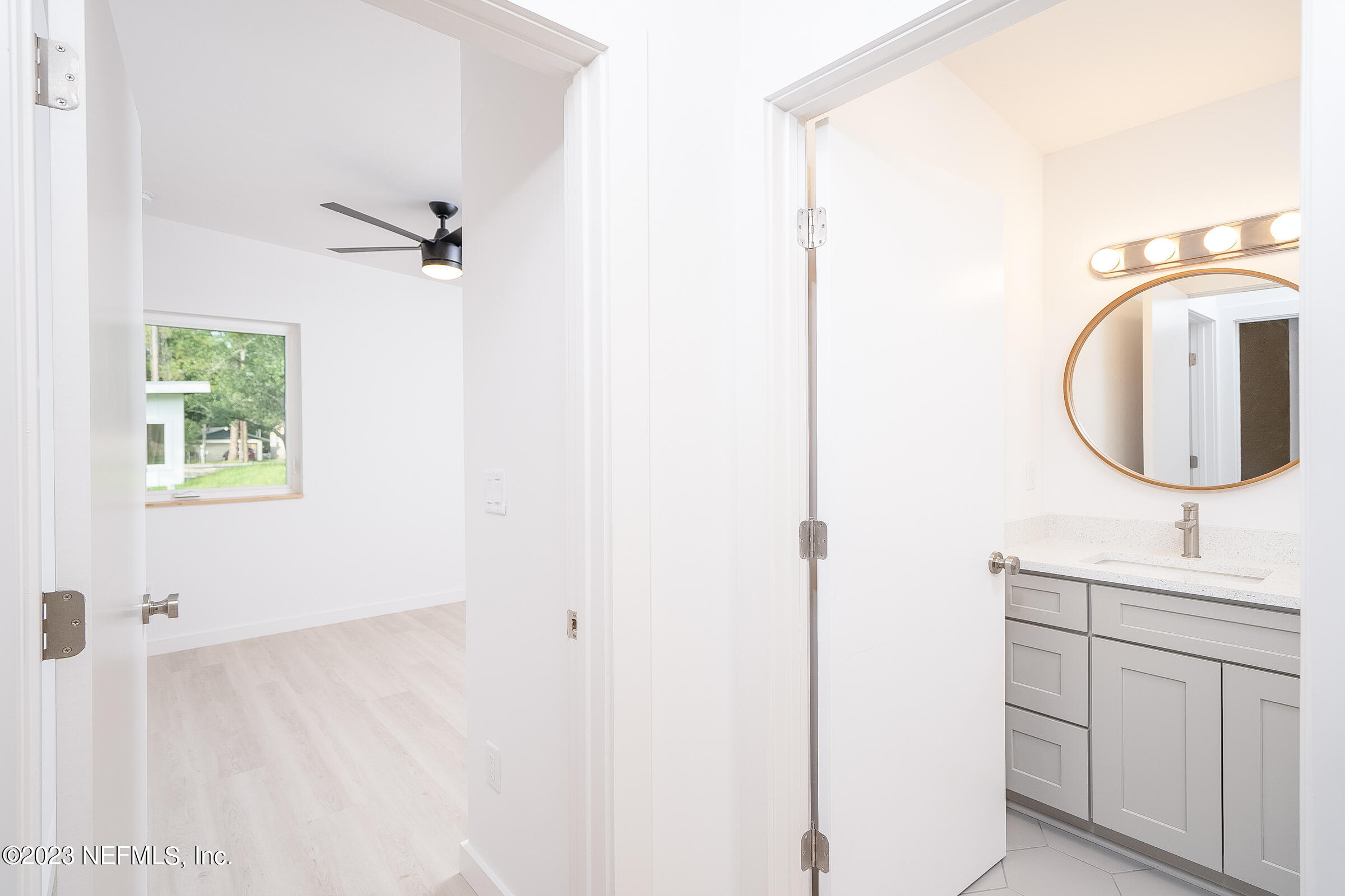 210 Yarbrough Road St. Augustine, FL 32095 - Photo 22 of 34 a bathroom with a sink vanity and a mirror