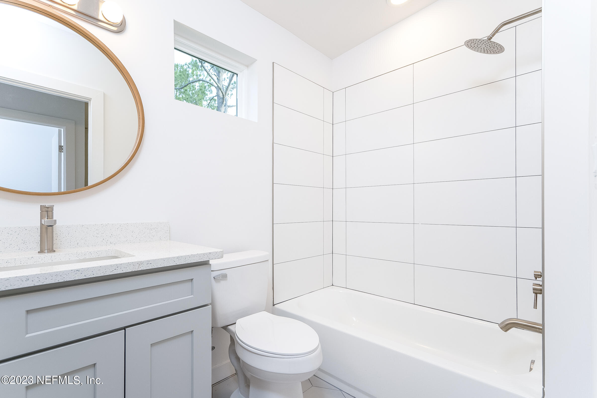 210 Yarbrough Road St. Augustine, FL 32095 - Photo 23 of 34 a bathroom with a sink a toilet and a mirror